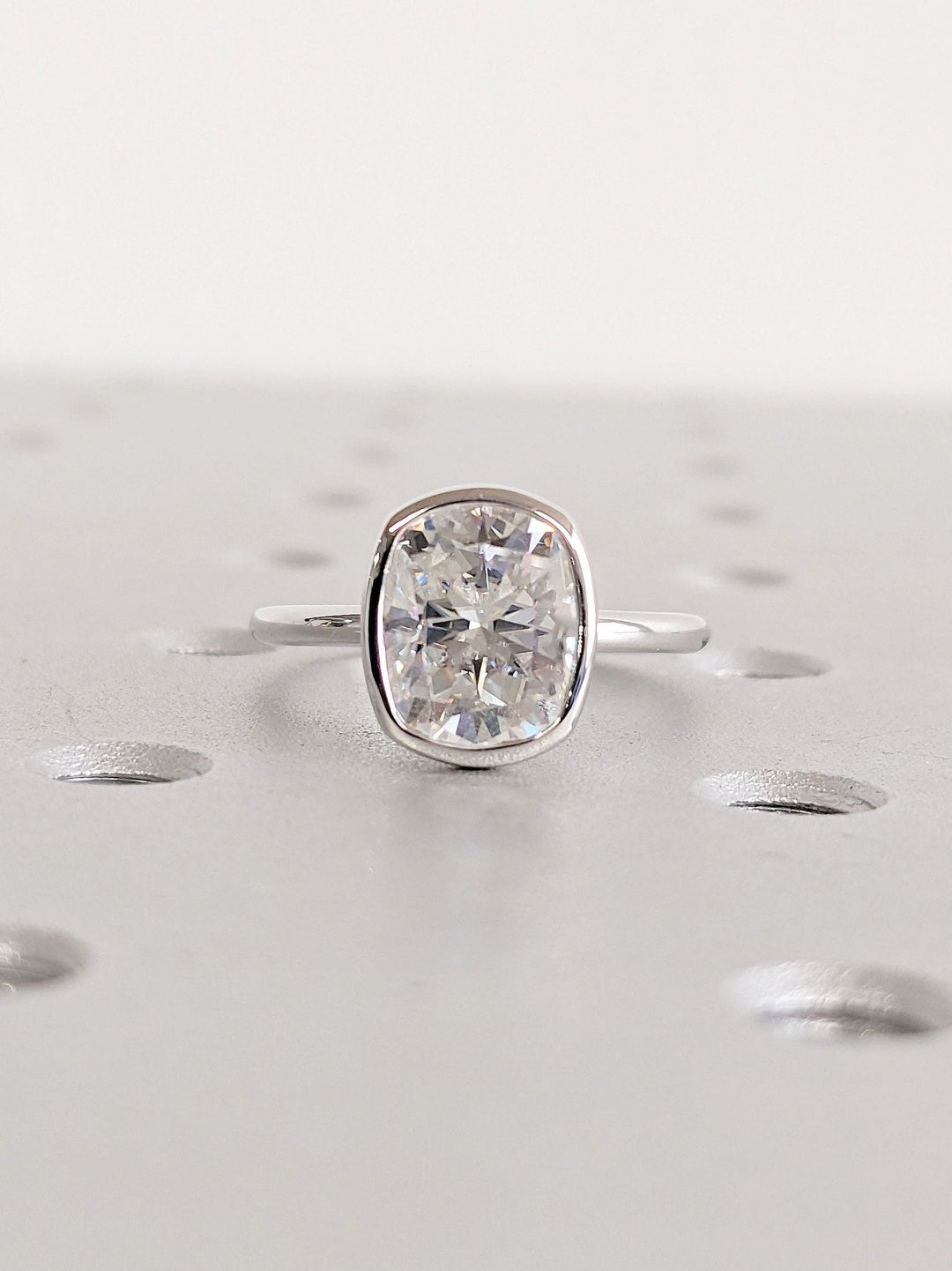 Top-down view of cushion cut bezel engagement ring