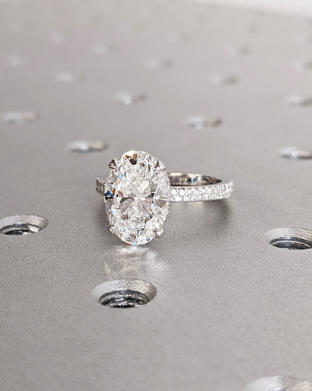 Oval hidden halo lab grown diamond ring in jewelry gift box