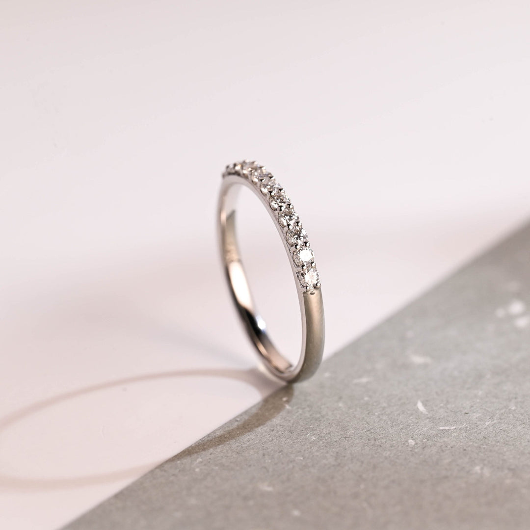Side view of round diamond wedding band