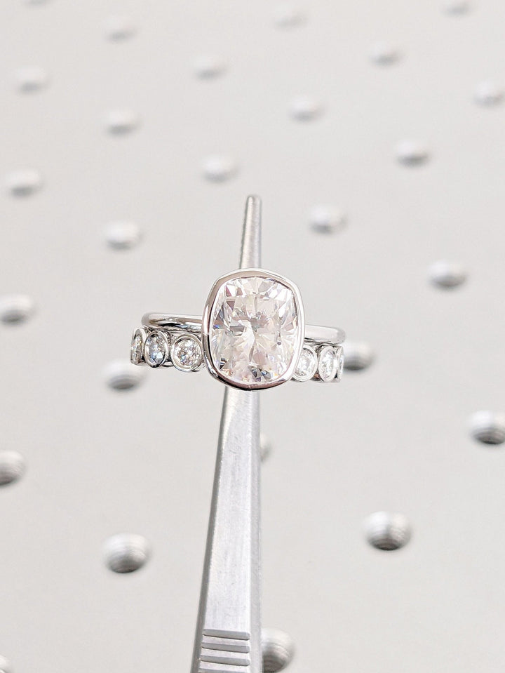 Detailed close-up of cushion bezel diamond engagement ring