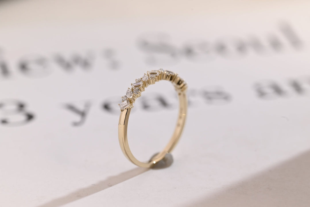 Side view of mix stone diamond wedding band