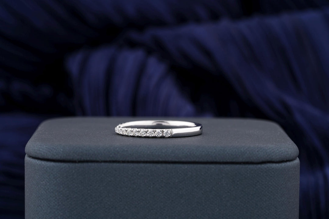 Round diamond band stacked with engagement ring