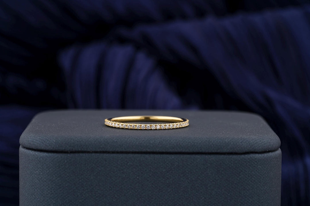 Round diamond band stacked with engagement ring