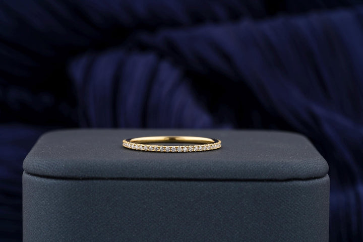 Round diamond band stacked with engagement ring