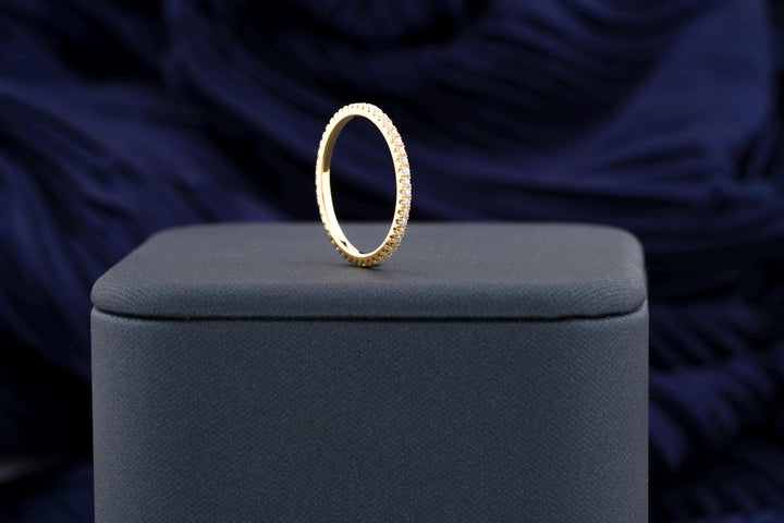 Round diamond band stacked with engagement ring