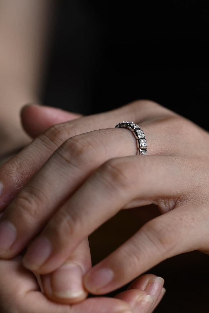 Princess diamond band stacked with engagement ring