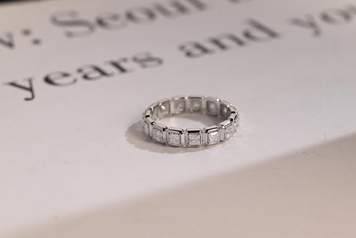 Princess diamond wedding band in yellow gold