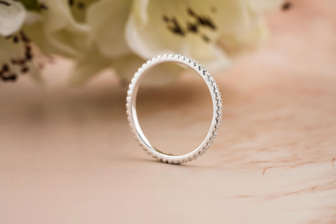 Round diamond band stacked with engagement ring
