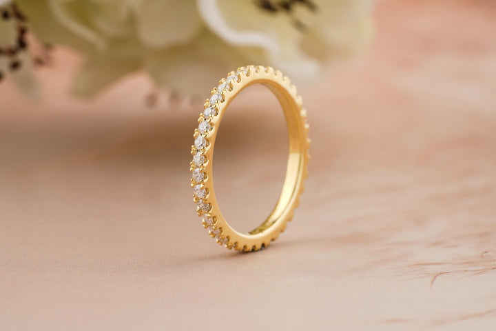 Round diamond band stacked with engagement ring