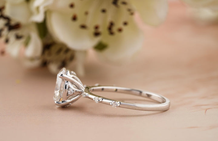Top-down view of oval cut pave engagement ring