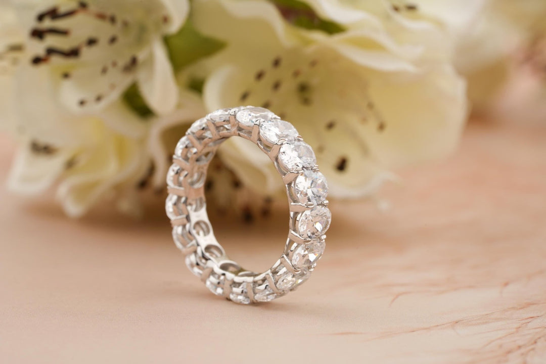 Round diamond band stacked with engagement ring
