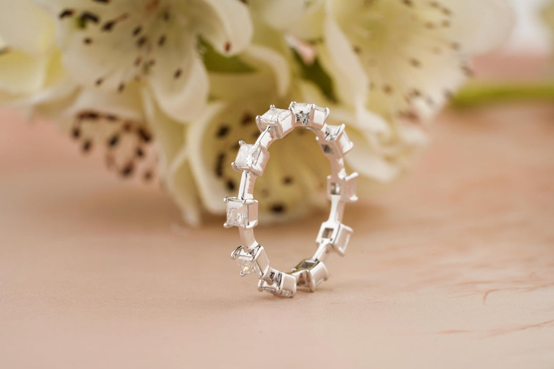 Princess diamond band stacked with engagement ring
