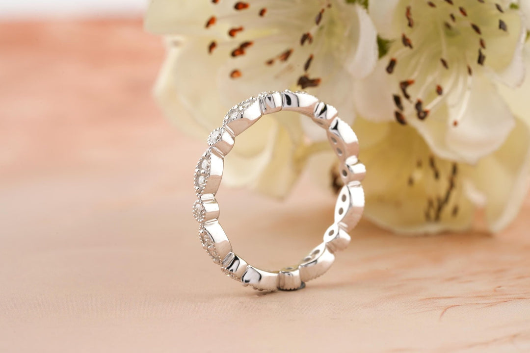 Round diamond band stacked with engagement ring