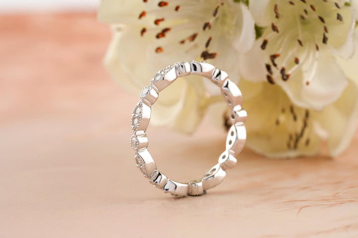 Round diamond band stacked with engagement ring