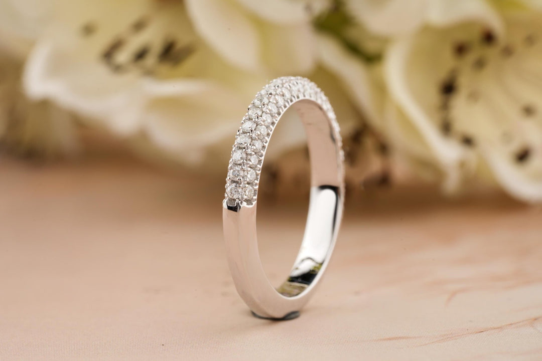 Round diamond band stacked with engagement ring