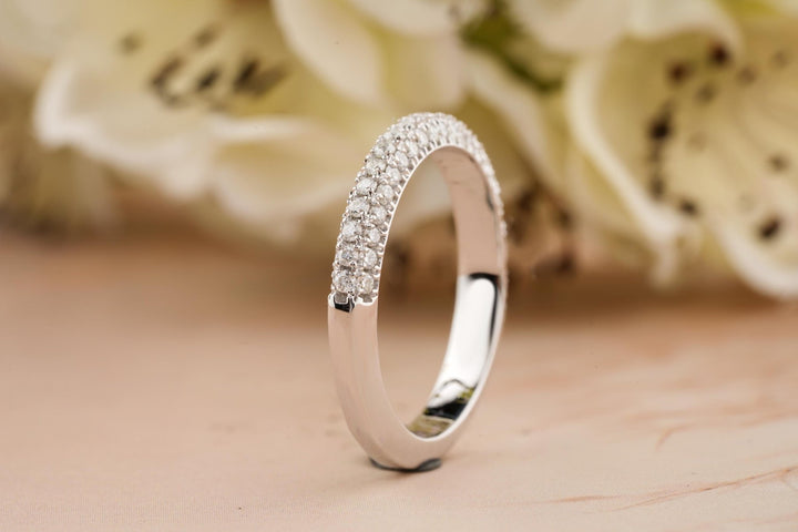 Round diamond band stacked with engagement ring