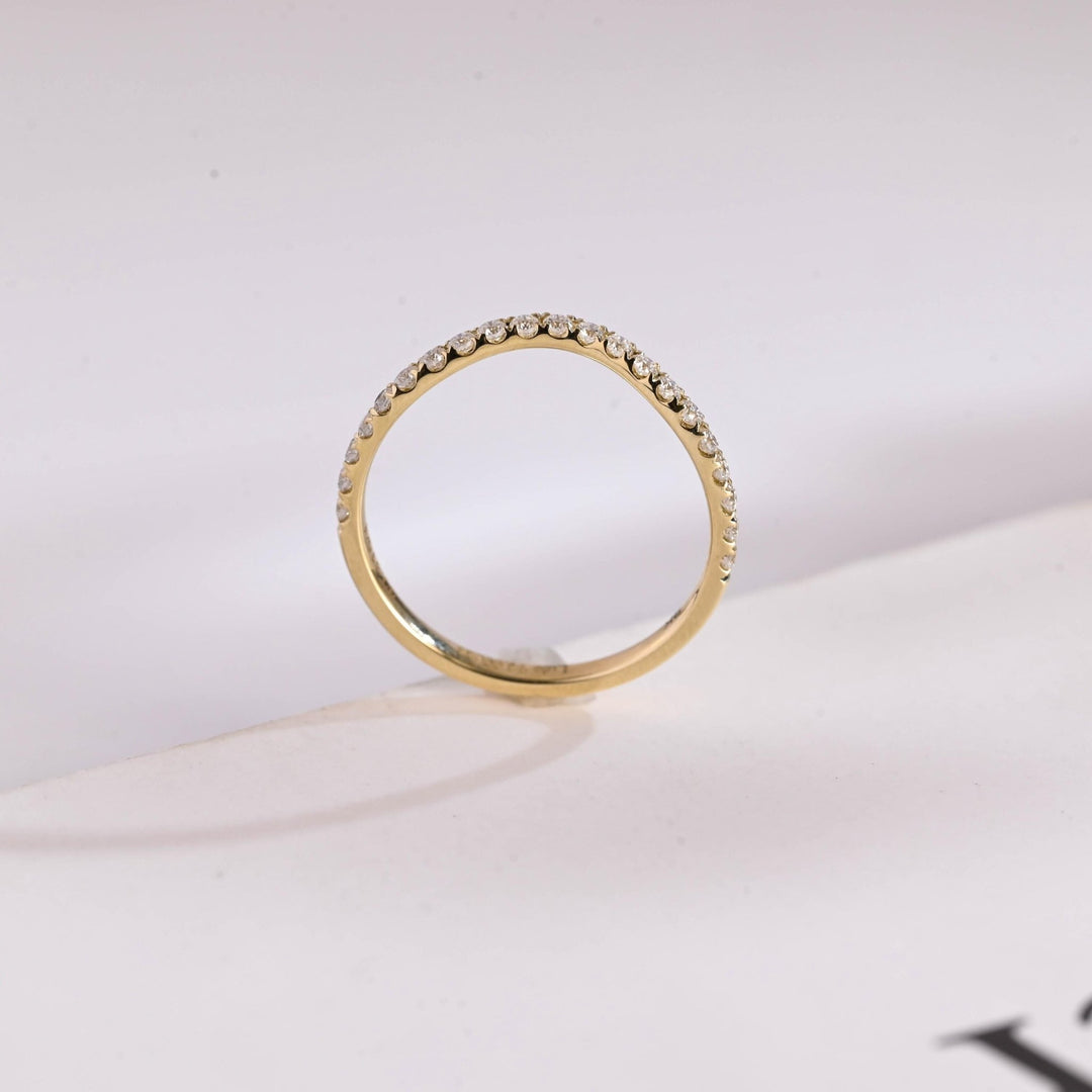 Side view of round diamond wedding band