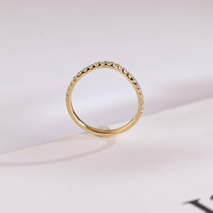 Side view of round diamond wedding band
