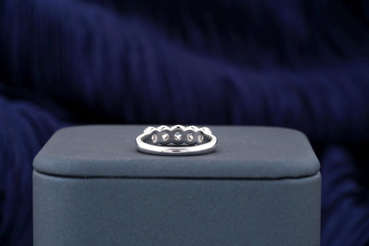 Round diamond band stacked with engagement ring