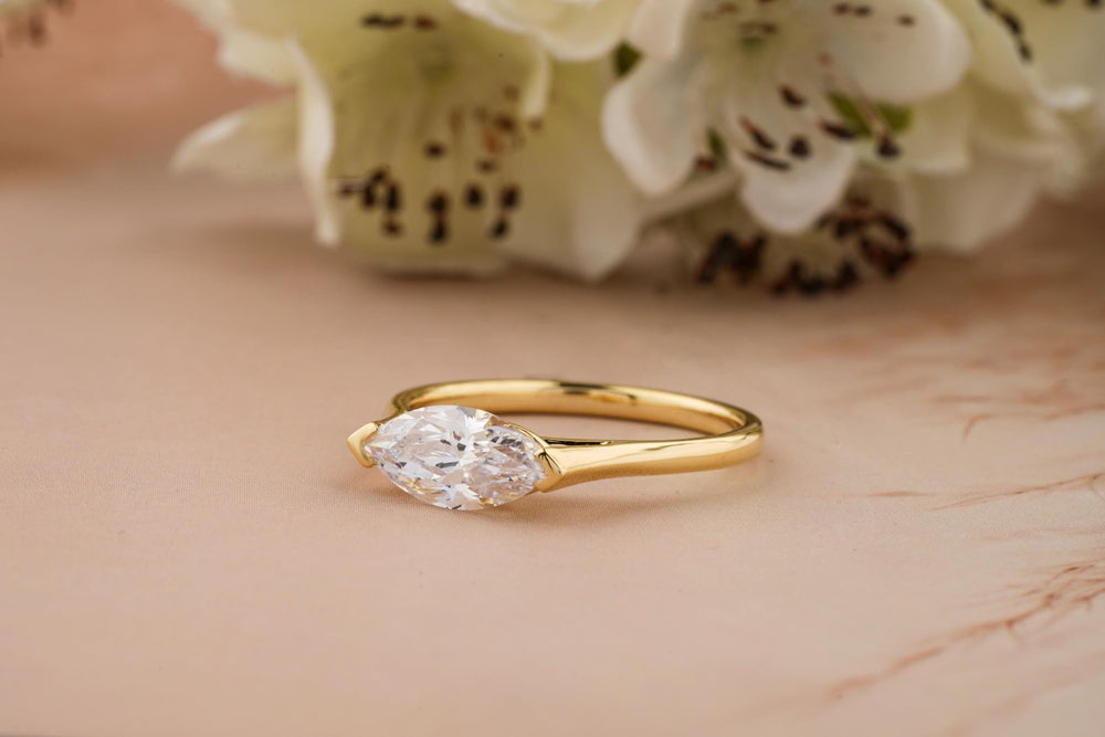 Angled view of marquise cut diamond in east west setting