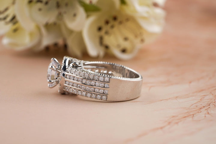 Certified round cut diamond featured in halo engagement ring