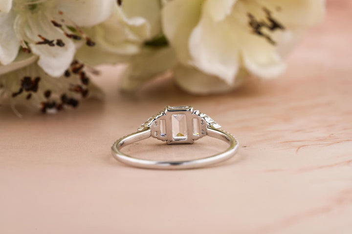 Close-up of emerald cut center diamond in solitaire engagement ring