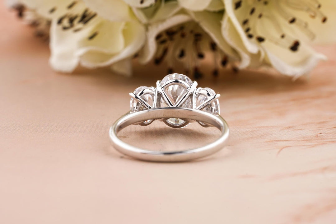 Oval cut solitaire engagement ring shown in real-life wear