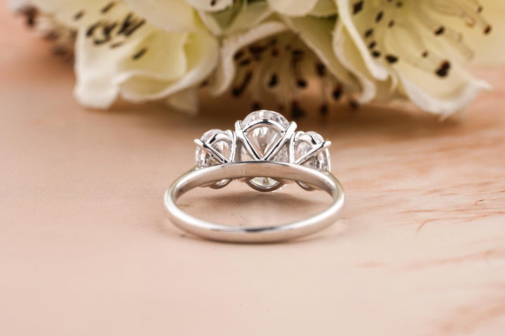 Oval cut solitaire engagement ring shown in real-life wear