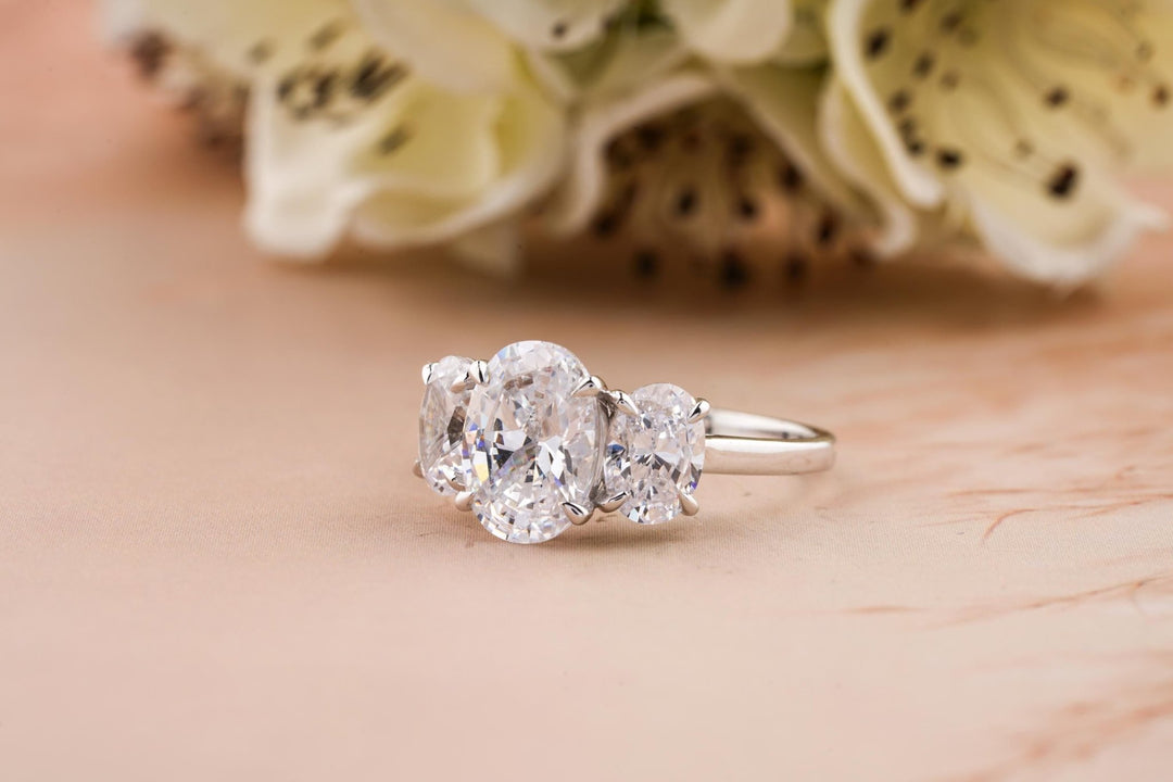 Oval cut diamond ring worn on hand