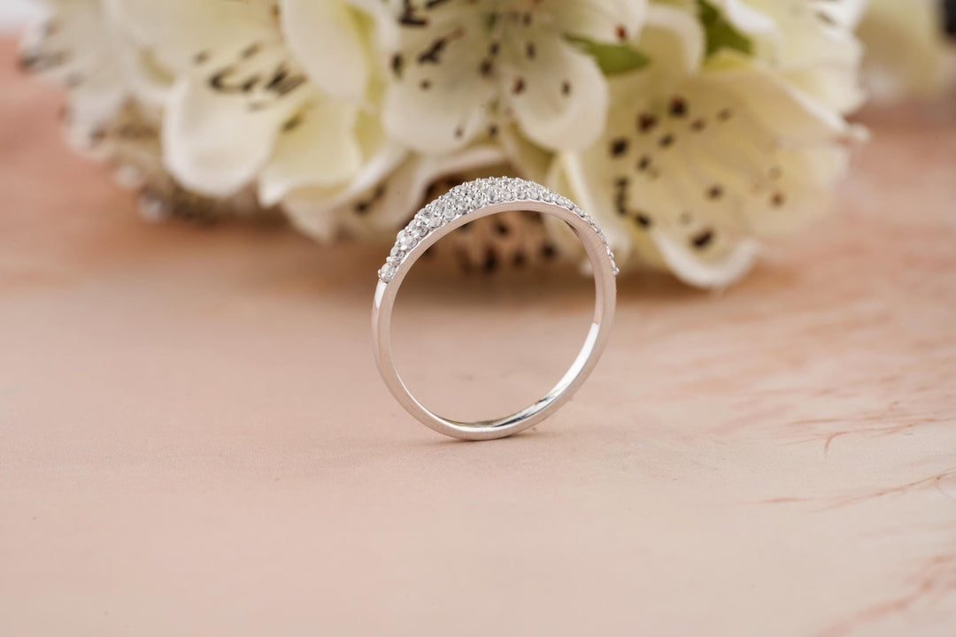 Round diamond band stacked with engagement ring