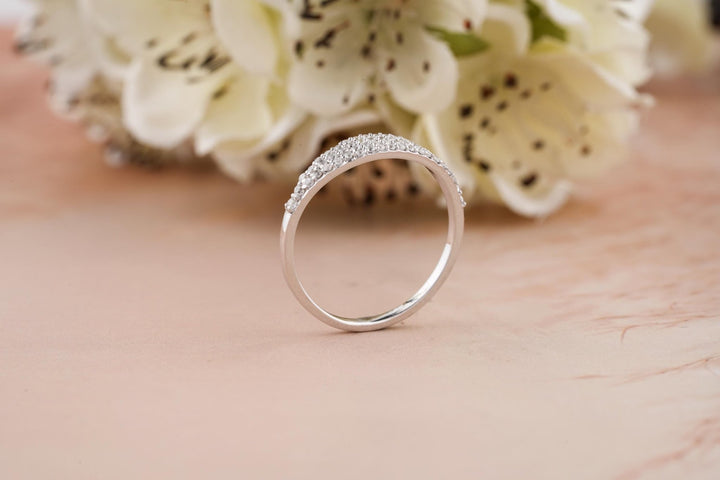 Round diamond band stacked with engagement ring