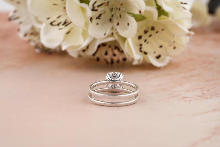 Certified cushion cut diamond featured in hidden halo engagement ring