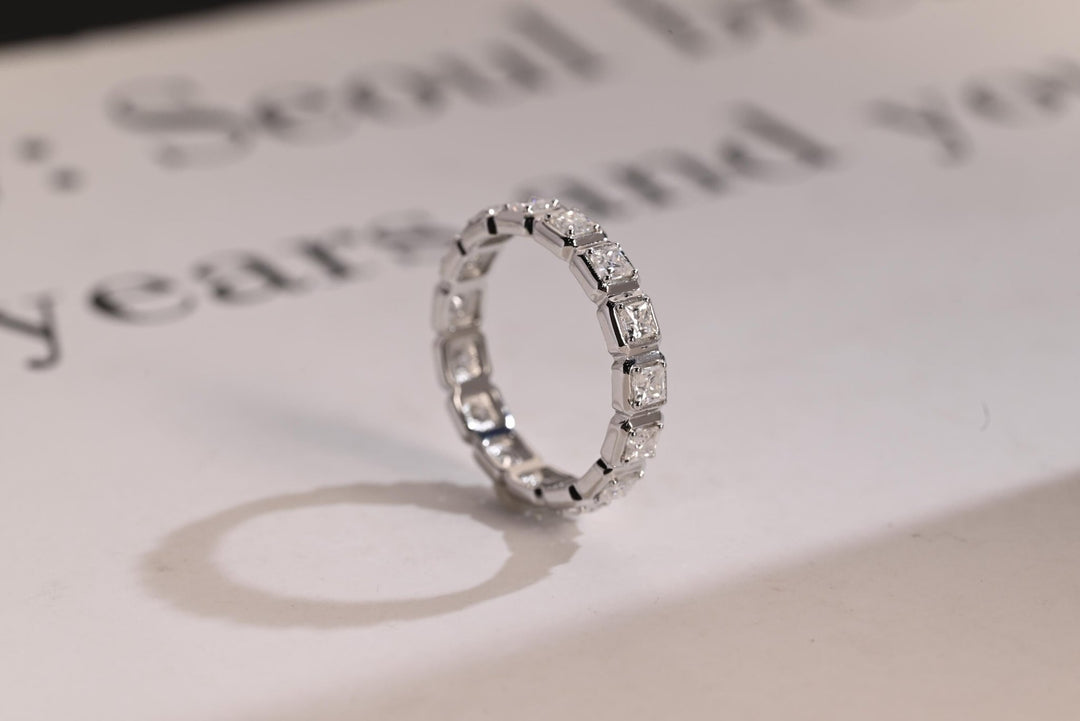 Side view of princess diamond wedding band