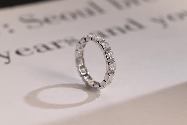 Side view of princess diamond wedding band