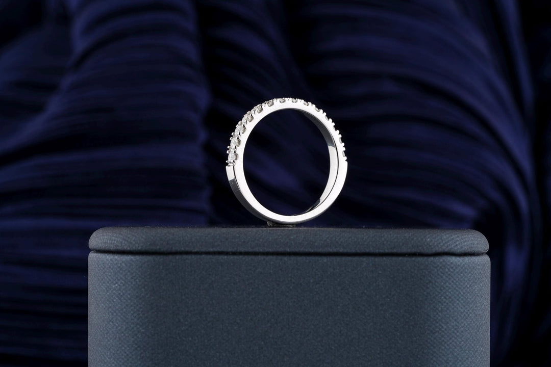 Round diamond band stacked with engagement ring