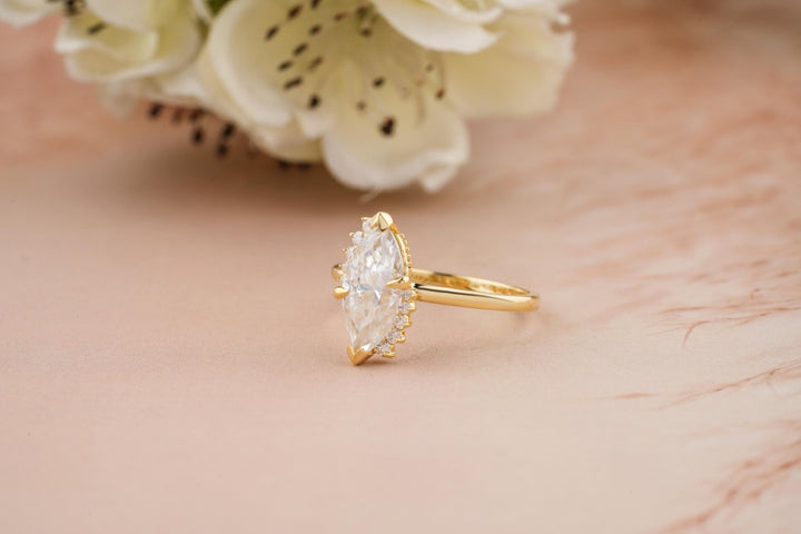 Marquise cluster ring set with an IGI graded diamond