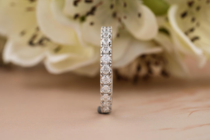 Round diamond band stacked with engagement ring