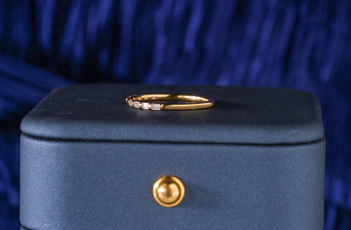 Round diamond band stacked with engagement ring