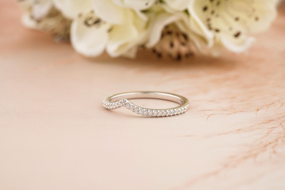Round diamond band stacked with engagement ring