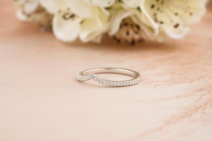 Round diamond band stacked with engagement ring