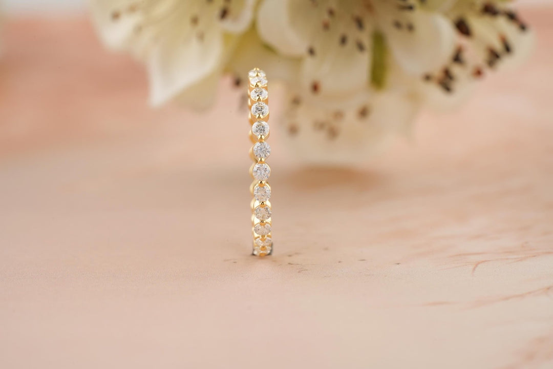 Round diamond band stacked with engagement ring