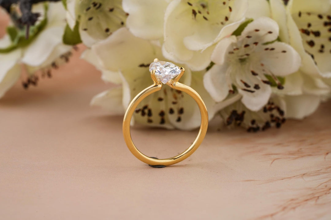 Pear cut diamond ring worn on hand