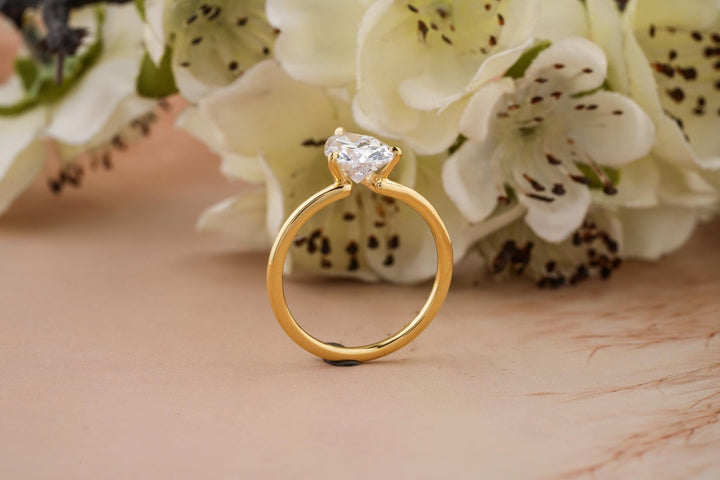 Pear cut diamond ring worn on hand
