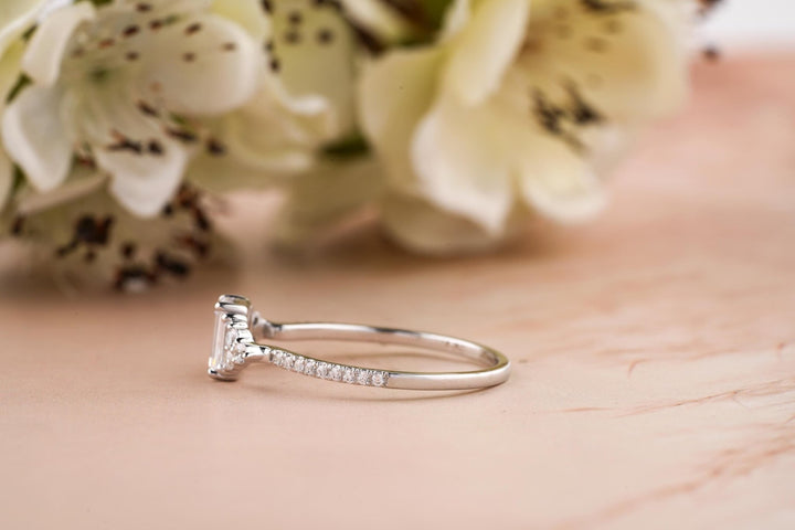 Macro shot of emerald cut diamond facets in solitaire ring setting