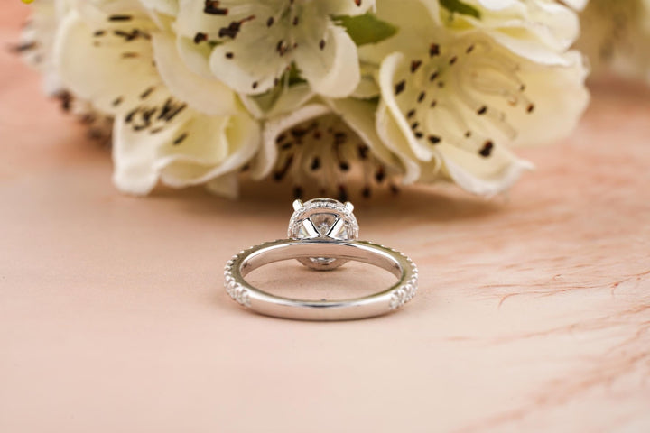 Round cut diamond ring worn on hand