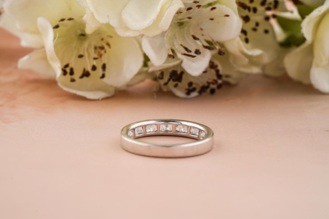 Princess diamond band stacked with engagement ring