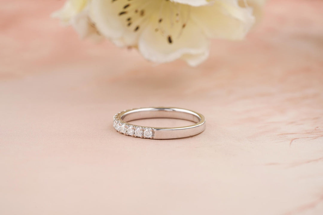 Round diamond band stacked with engagement ring