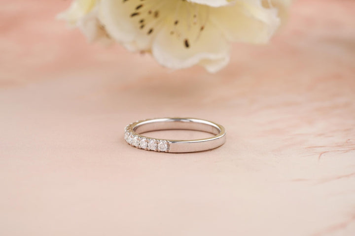 Round diamond band stacked with engagement ring