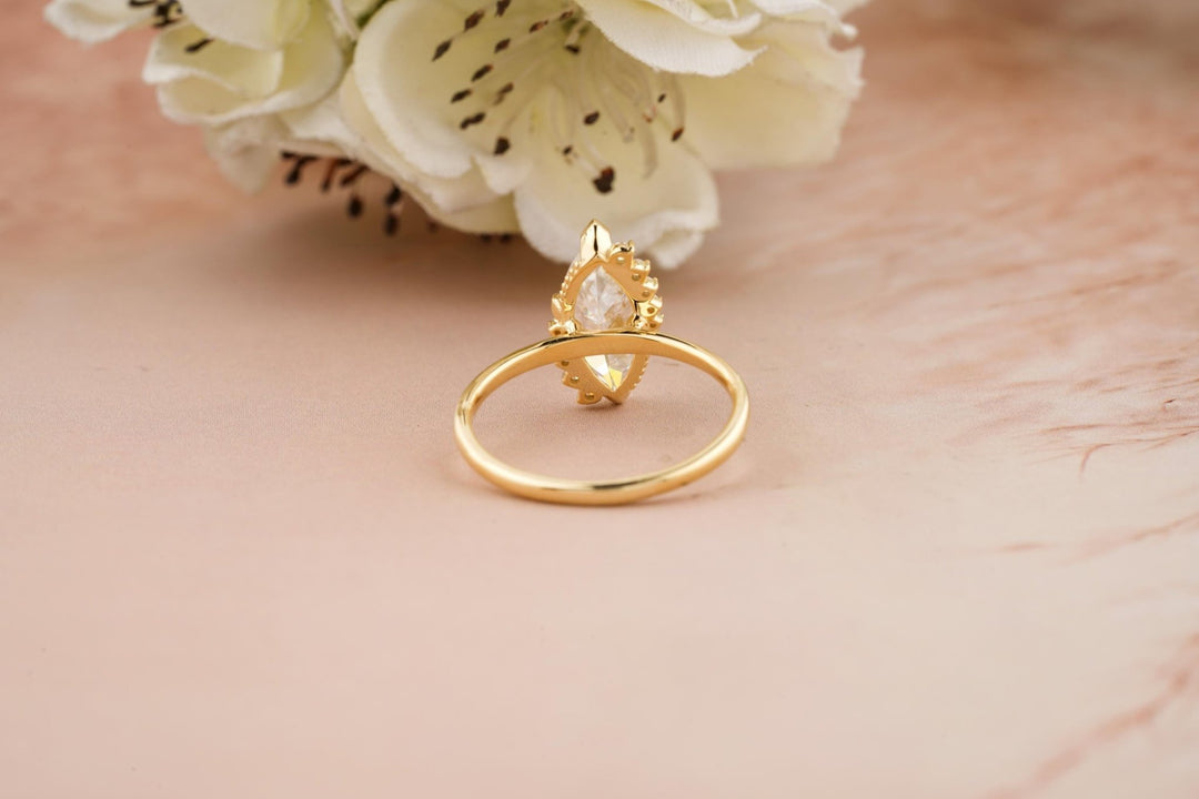 Marquise cluster diamond engagement ring available in multiple metals