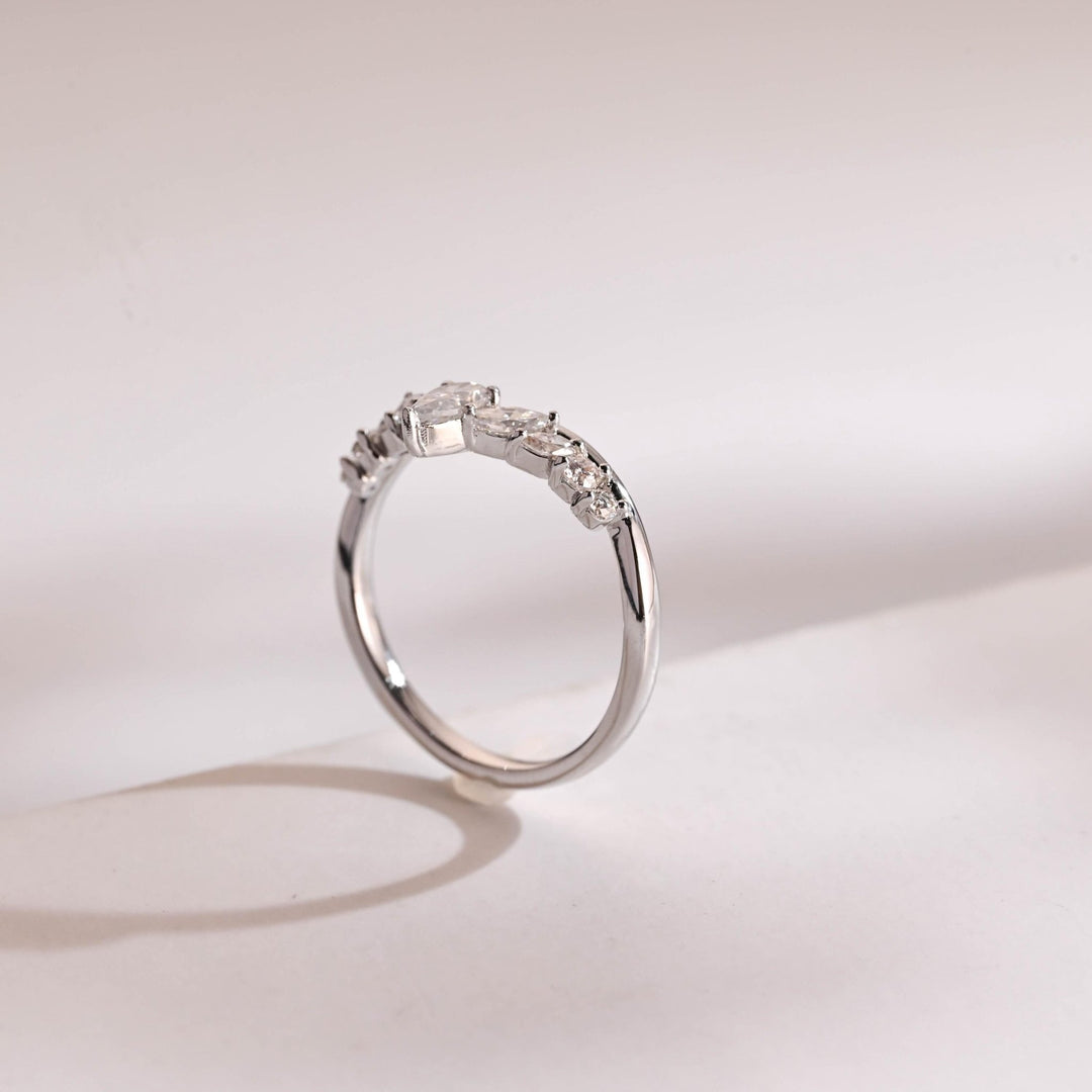 Side view of marquise & round diamond wedding band
